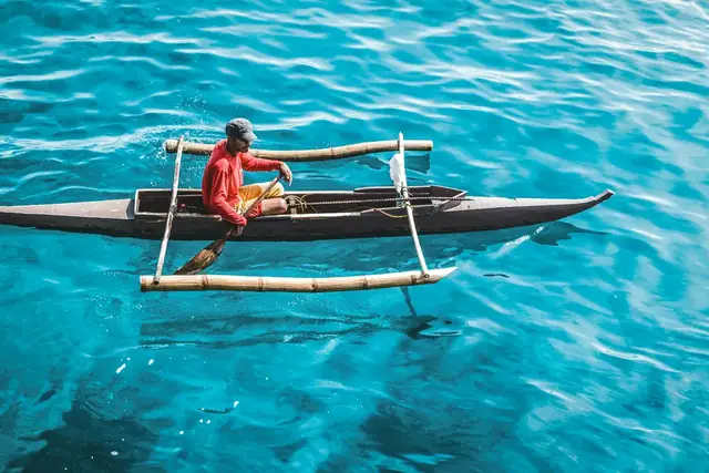 Local fisherman in Bangka boat near Cebu, Philippines. Photo by Hector John Periquin
