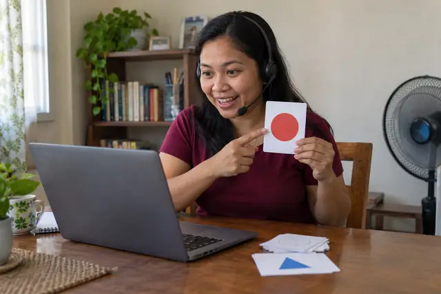 AI-generated scene of an online tutor teaching from a simple home table in the Philippines