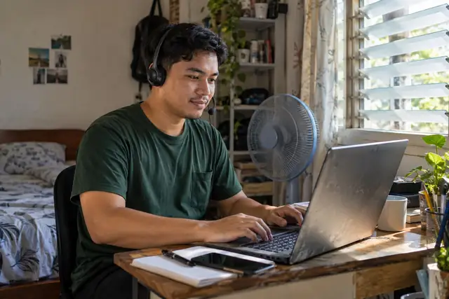 AI-generated scene of a remote worker using a headset at a simple home desk in the Philippines